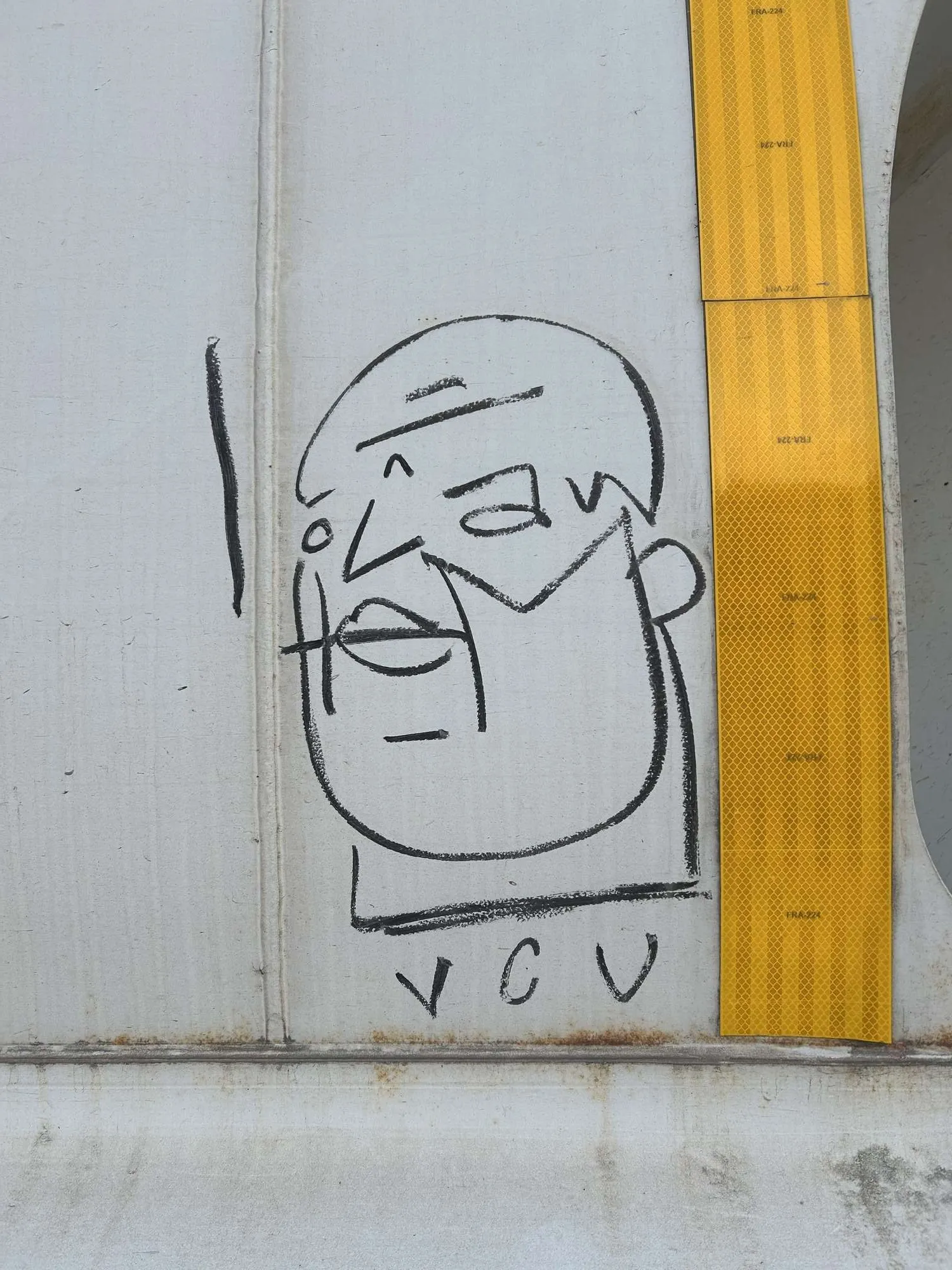 A clever signature on the side of a train in the yard